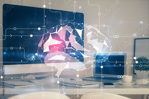Double exposure of table with computer and brain hologram. Data innovation concept.