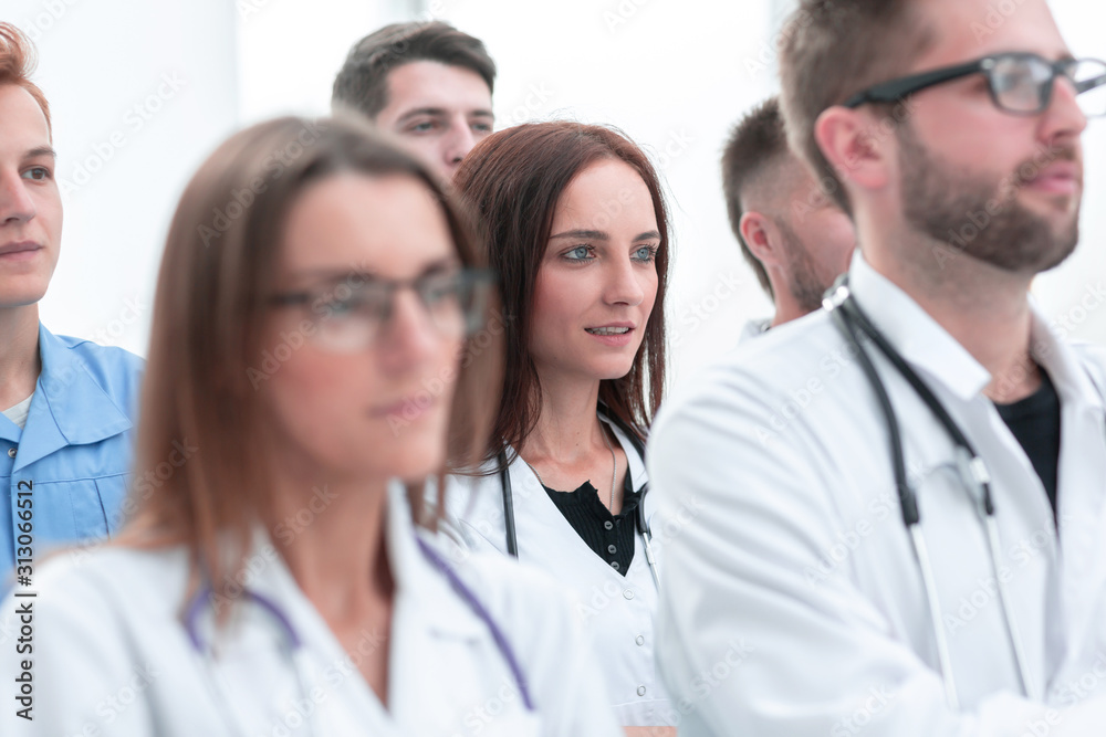 large group of doctors supported their success with applause large group of doctors supported their success with applause