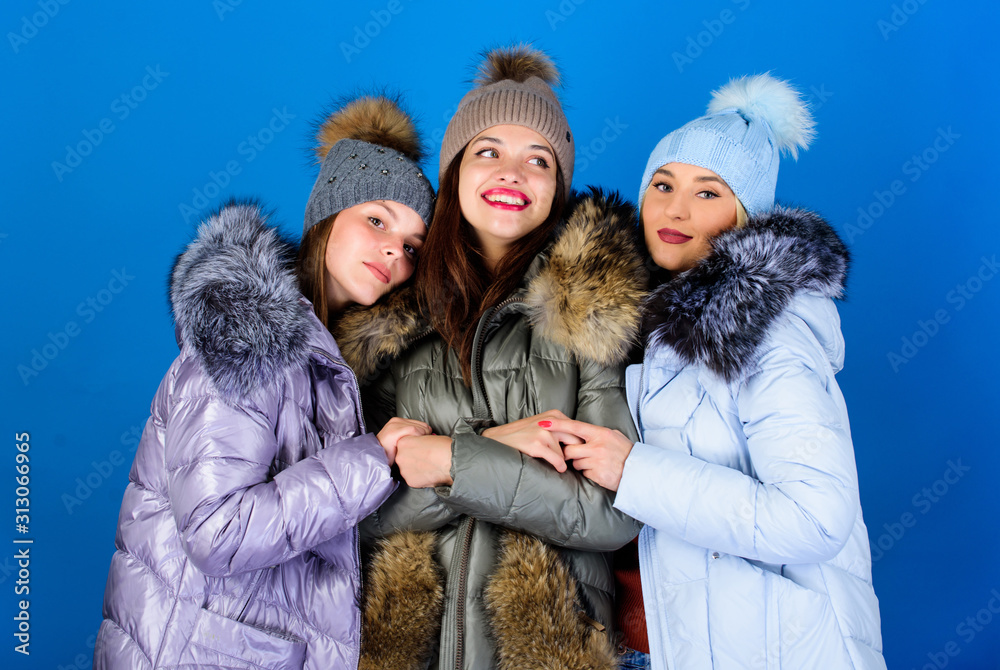 Emotional women in jackets. Group friends hang out together. Female clothes shop. Modern trendy female outfit. Gorgeous girls makeup faces cuddling. Female fashion. Girls friends having fun in winter Emotional women in jackets. Group friends hang out together. Female clothes shop. Modern trendy female outfit. Gorgeous girls makeup faces cuddling. Female fashion. Girls friends having fun in winter
