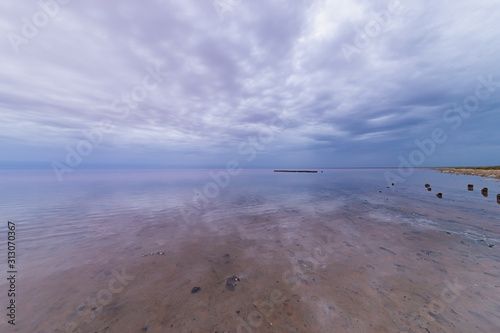 Elton Salt Lake with a pink hue of water and clouds