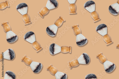 Zero waste pattern. Natural shaving brushes on orange background. Flat lay  top view.