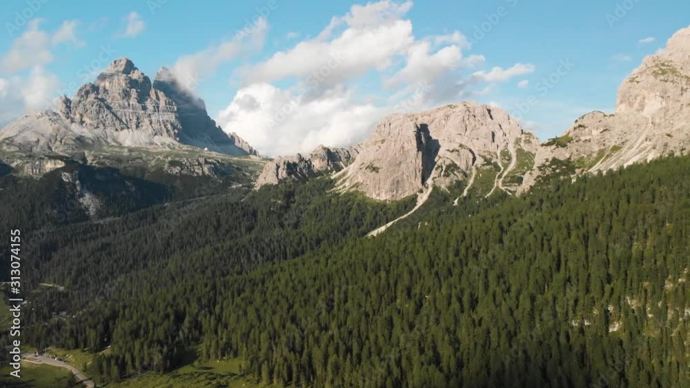 shooting from a drone view of the Alps in the north of Italy gray-green lake snow elks, melting glacier, cloudy sky. Summer in Italy, green forests. shooting from a drone view of the Alps in the north of Italy gray-green lake snow elks, melting glacier, cloudy sky. Summer in Italy, green forests.
