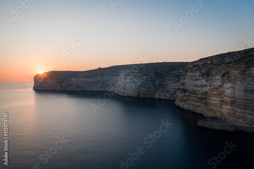Sunset over the Cliffs of Xlendi in Gozo