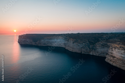 Sunset over the Cliffs of Xlendi in Gozo