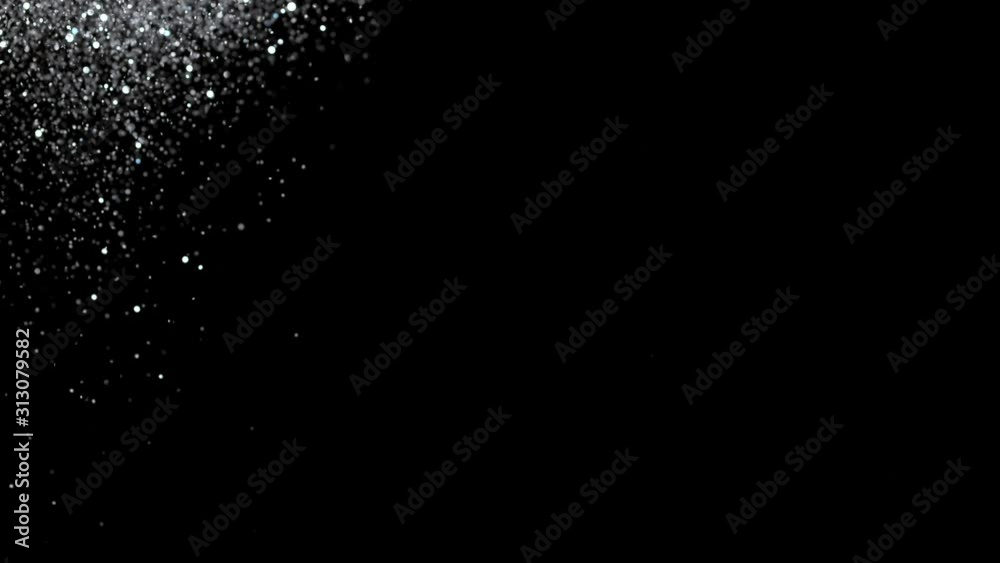 Falling silver glitter particles. Falling shiny confetti with magic, sparkling, bokeh light Falling silver glitter particles. Falling shiny confetti with magic, sparkling, bokeh light