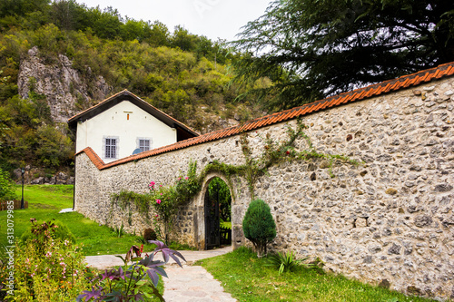 The Library, courtyard, the belfry and the church of  Assumption of Mary in Serbian Orthodox monastery (cloister) Moracha in Montenegro, founded in 1252,  Rascian architectural style, frescoes photo