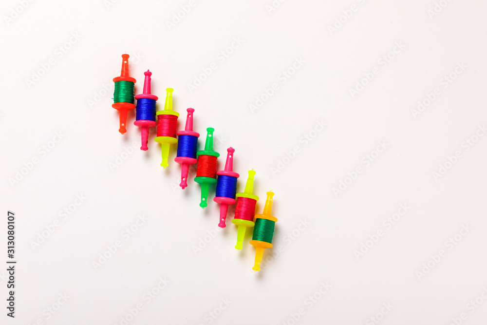 Indian festival makar sankranti concept, Kite String with Sesame seed ball or til ke laddo Indian festival makar sankranti concept, Kite String with Sesame seed ball or til ke laddo