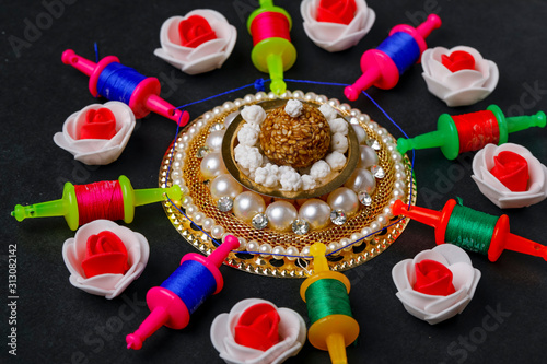 Indian festival makar sankranti concept, Kite String with Sesame seed ball or til ke laddo photo