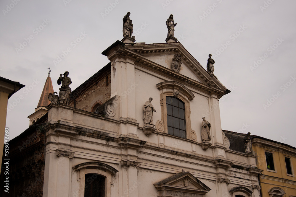 Facade of the church of Santa Maria in Foro called Dei Servi in Vicenza, Italy. Made in 1710 with stone moldings and capitals, with nine statues made by Angelo and Orazio Marinali and Giovanni Calvi.