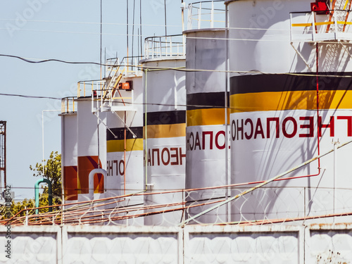 Tank the vertical steel. Capacities for storage of oil products. Caption: flammable. photo