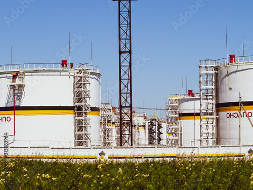 Tank the vertical steel. Capacities for storage of oil products. Caption: flammable. photo