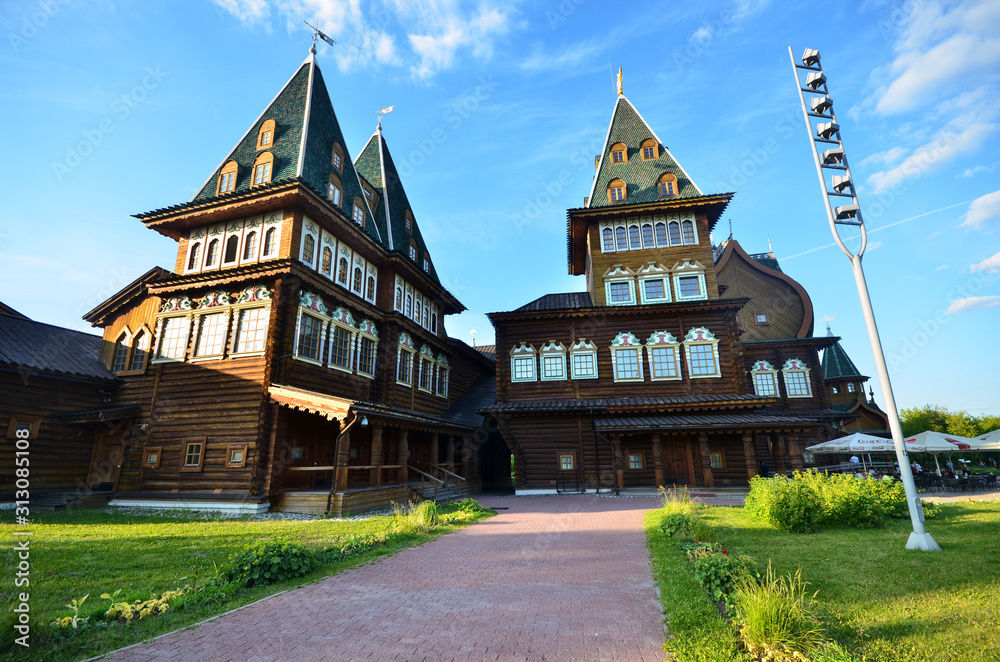 Wooden Palace Of Moscow Kolomenskoye - colorful Tourism landmark attractions in Russia - royal old palace with golden cyan brown green white colors made out of wood