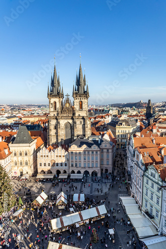 Old Town of Prague, Czech Republic. View on Tyn Church and Jan Hus Memorial on the square as seen from Old Town City Hall during Christmas market