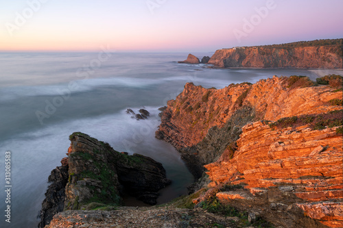 Praia de Odeceixe beach in Costa Vicentina at sunset, Portugal