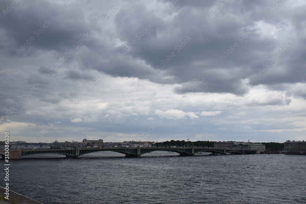 St petersburg Bridge crossing lake in cloudy day  in Russia