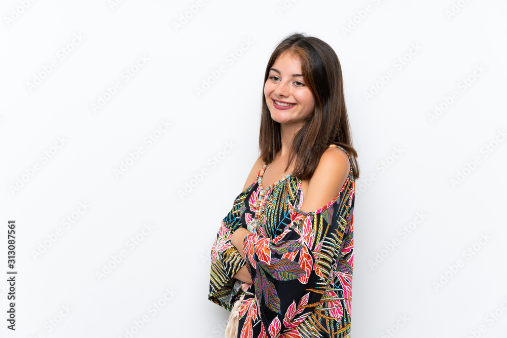 Caucasian young woman in colorful dress on isolated white background looking to the side Caucasian young woman in colorful dress on isolated white background looking to the side