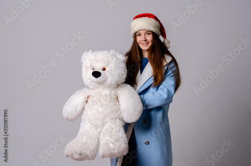 Beautiful happy woman in Santa Claus clothes photo