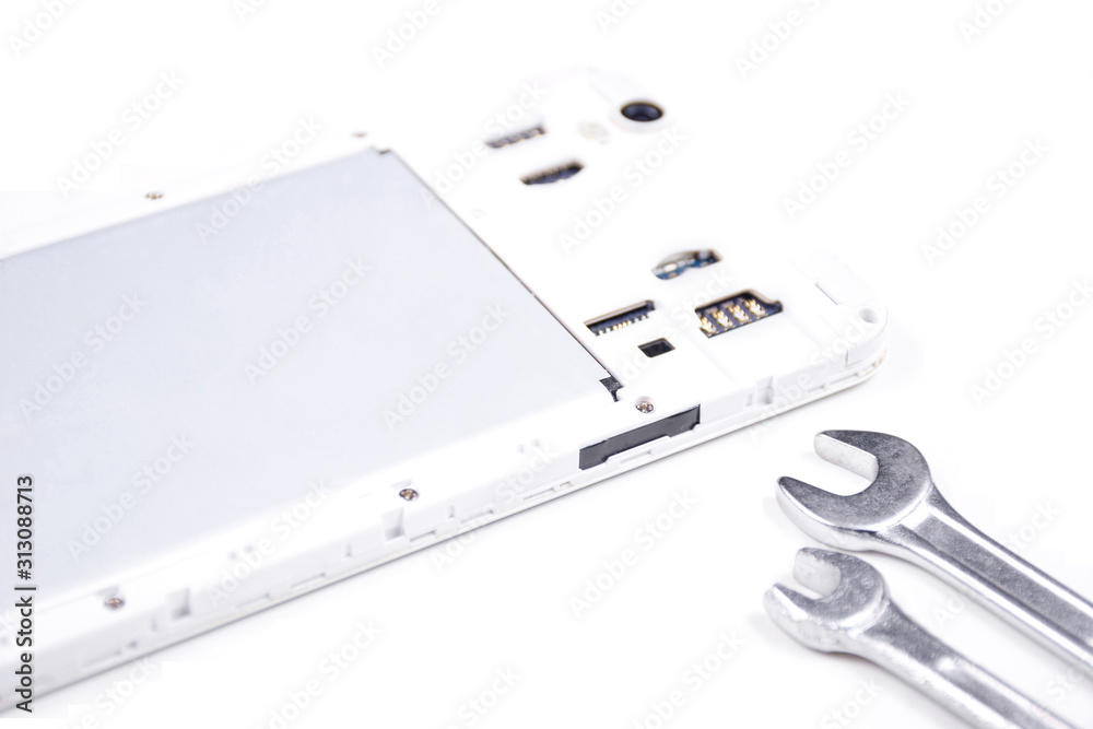 Cell phone with a broken screen on a white background. Cell phone with a broken screen on a white background.