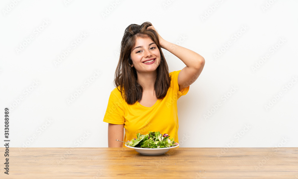 Caucasian girl with salad laughing Caucasian girl with salad laughing