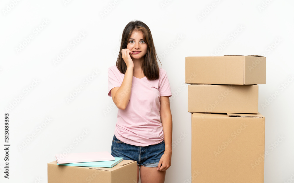 Young girl moving in new home among boxes nervous and scared Young girl moving in new home among boxes nervous and scared