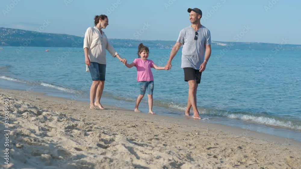 Family stroll on the beach. Family stroll on the beach.