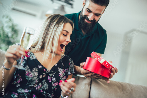 Happy young couple having romantic day at home.