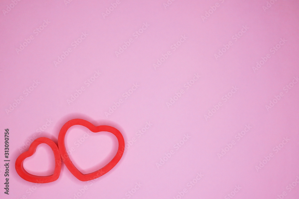 Two hearts on a pink background. Holiday concept. February 14, Valentine's Day, mother's day.