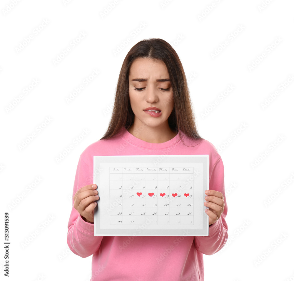 Young woman holding calendar with marked menstrual cycle days isolated on white Young woman holding calendar with marked menstrual cycle days isolated on white