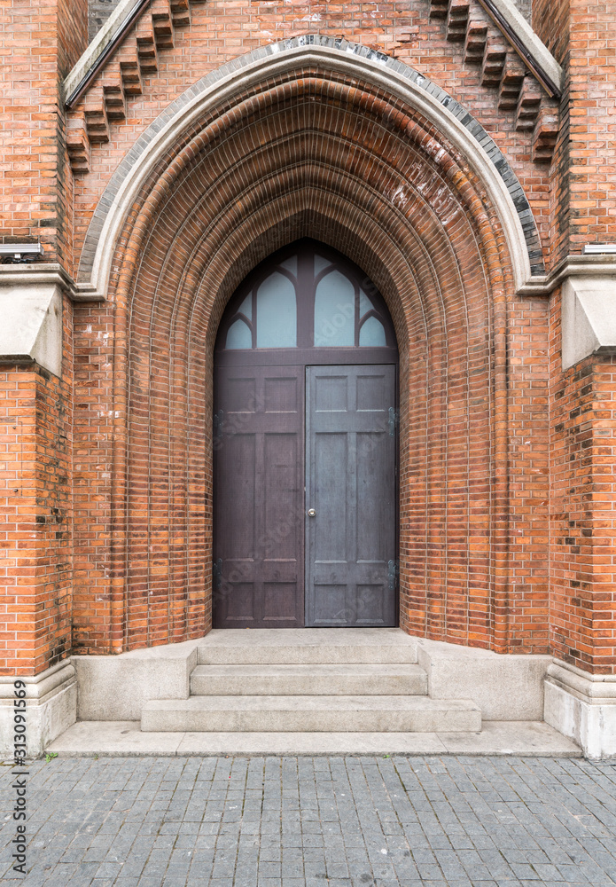 Fototapeta premium The door of Gothic architecture in Shanghai
