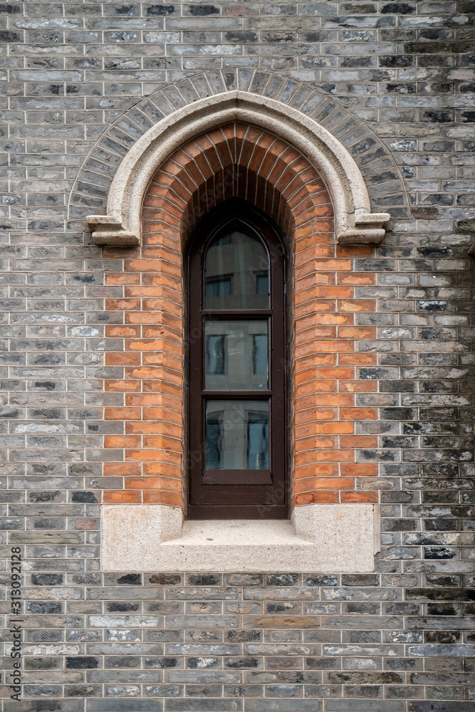 Gothic windows and brick walls
