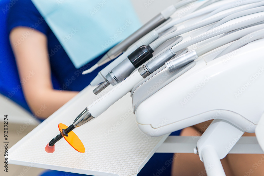 Different dental instruments and tools in a dentists office Different dental instruments and tools in a dentists office