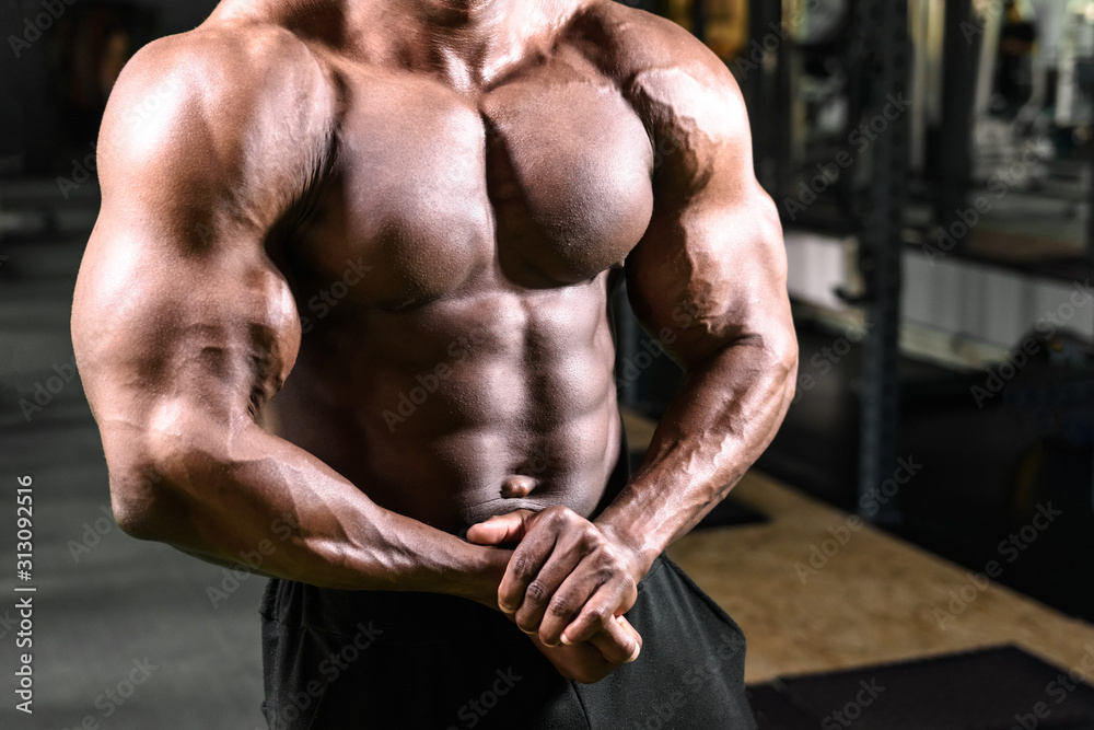 African bodybuilder posing in the gym