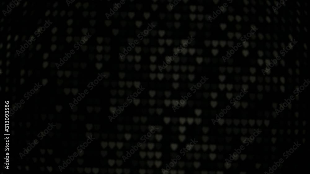 colorful heart bokeh lighting moving in dark background