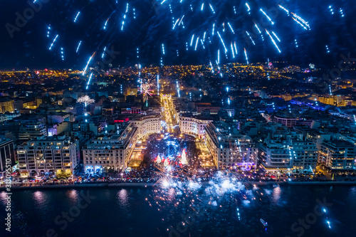 Aerial view of Aristotelous square in Thessaloniki during New Year celebrations with fantastic multi-colored fireworks