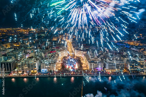 Aerial view of Aristotelous square in Thessaloniki during New Year celebrations with fantastic multi-colored fireworks photo