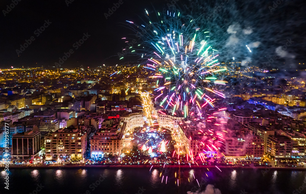Aerial view of Aristotelous square in Thessaloniki during New Year celebrations with fantastic multi-colored fireworks Aerial view of Aristotelous square in Thessaloniki during New Year celebrations with fantastic multi-colored fireworks