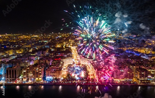 Aerial view of Aristotelous square in Thessaloniki during New Year celebrations with fantastic multi-colored fireworks