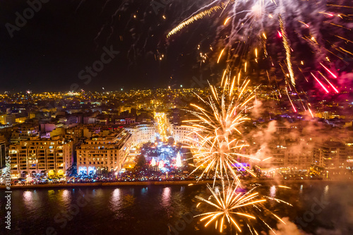 Aerial view of Aristotelous square in Thessaloniki during New Year celebrations with fantastic multi-colored fireworks