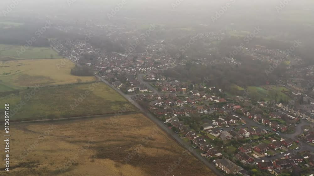 Aerial views over a small English countryside village in the North West Aerial views over a small English countryside village in the North West