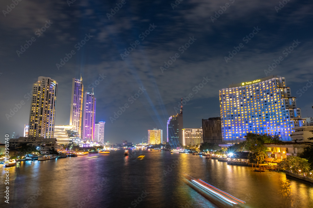 City view by the river Bright night The beauty of the capital