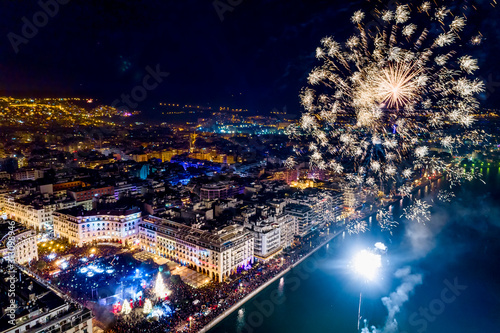 Aerial view of Aristotelous square in Thessaloniki during New Year celebrations with fantastic multi-colored fireworks