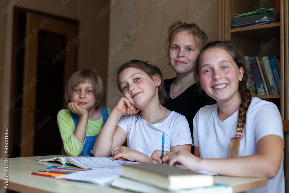 Fototapeta premium Girlfriends learning lessons at home