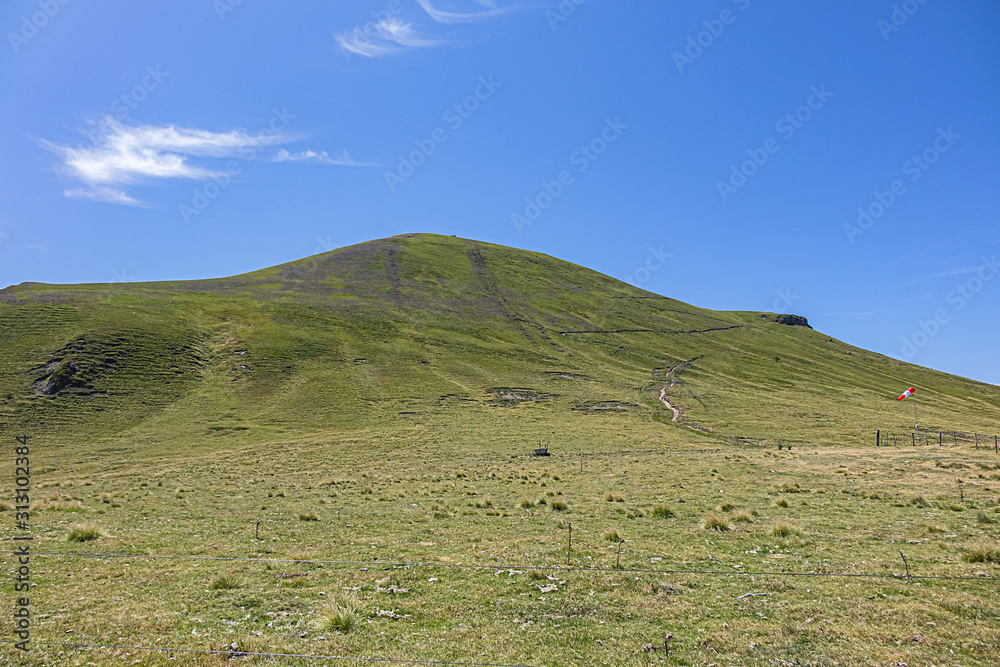 Obraz premium Beautiful highland landscapes in Volcans d'Auvergne regional Natural Park. Monts Dore - the heart of the Massif Central, Auvergne-Rhone-Alpes administrative region, France.