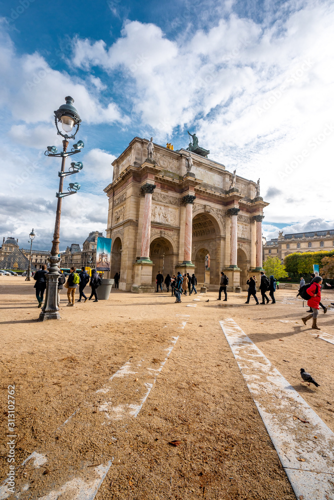 View Arc de Triomphe du Carrousel near Louvre museum during Autumn season late morning . One of the most important Arch in  the heart of Paris , France