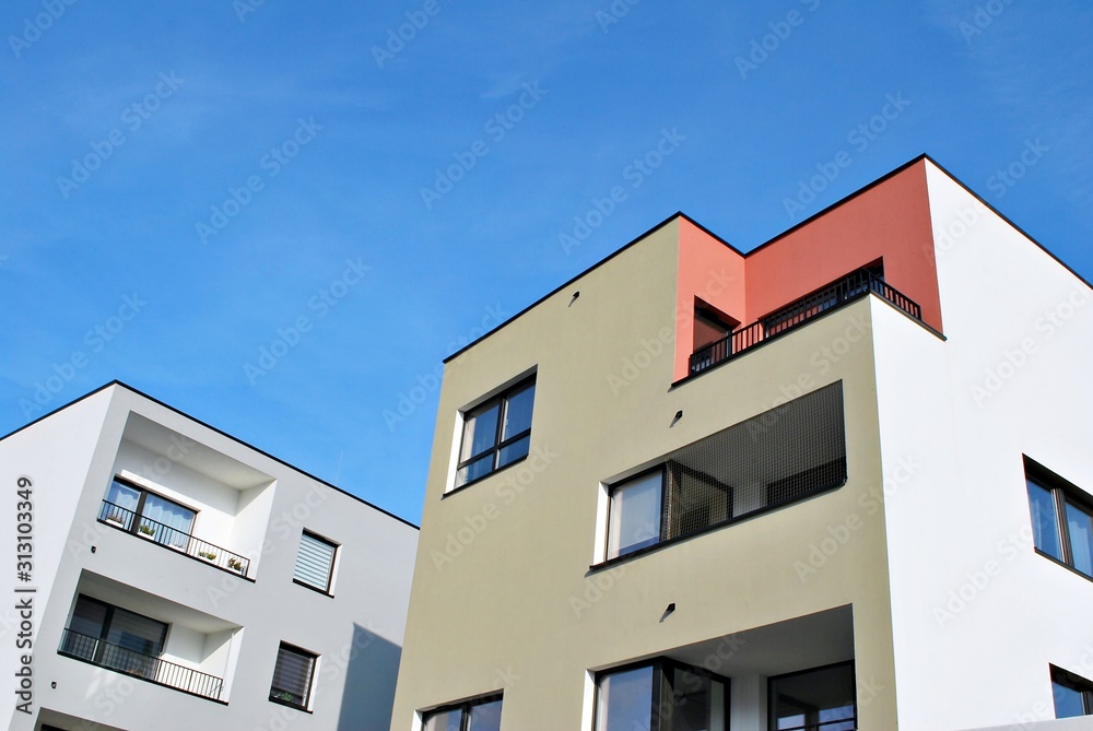 Modern apartment buildings on a sunny day with a blue sky. Facade of a modern apartment building