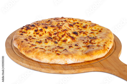 Georgian traditional food khachapuri on a wooden dish on white background.