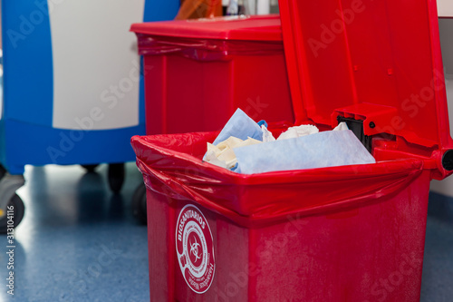 Biological risk waste disposed of in the red trash bag at a operating room in a hospital