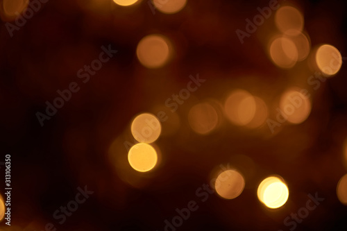 beautiful yellow bokeh lights background on dark © Ekaterina Bokova