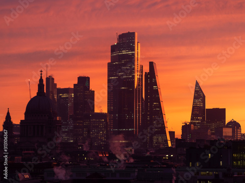 Epic dawn sunrise landscape cityscape over London city sykline looking East along River Thames photo