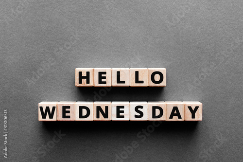 Quadro em tela Hello wednesday - words from wooden blocks with letters, hello wednesday concept